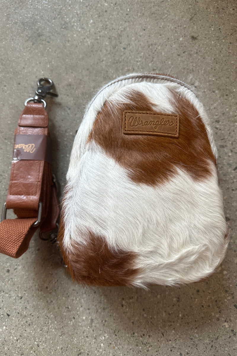 Trestles Clothing Company Western sling bag in brown and white hair-on cowhide with a detachable leather strap